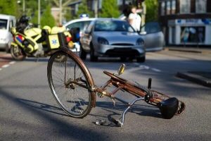 Damaged bicycle in Santa Rosa on its side due to accident.