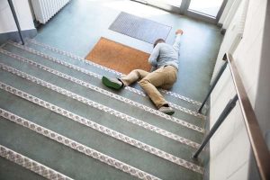 An unconscious man in Windsor lying on the staircase after slipping.