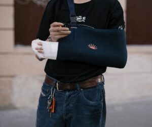 An injured kid with arm sling.